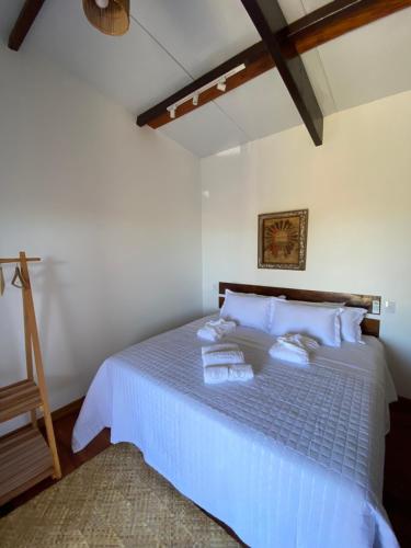 Postel nebo postele na pokoji v ubytování Aponem Spa & Pousada