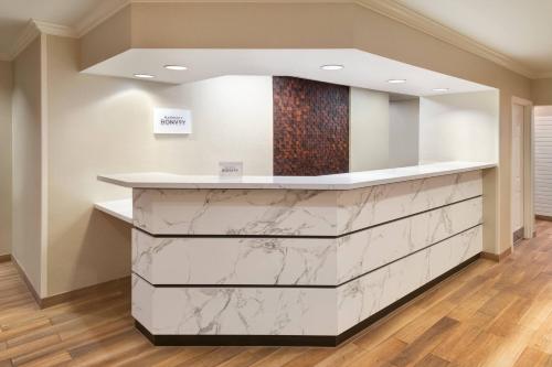 a marble counter in a room with wood floors at Residence Inn by Marriott State College in State College
