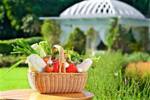 a basket of vegetables sitting on a table at Gaeavilla Resort in Jian