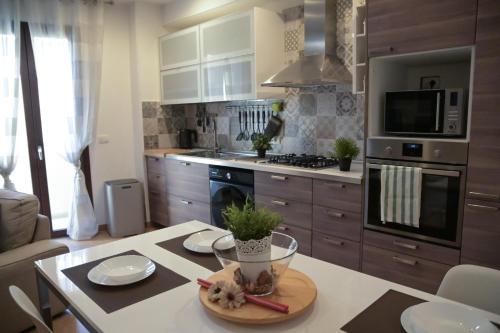 a kitchen with a counter with a table with a plate on it at Giorgia House in Pieta