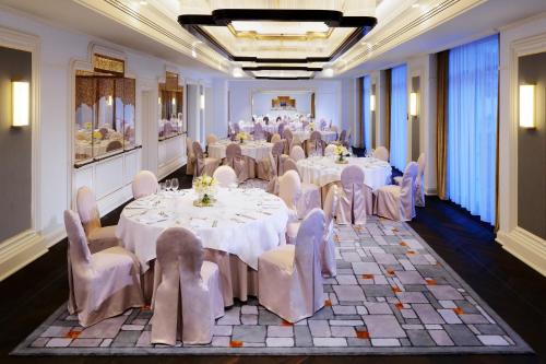 a banquet room with white tables and white chairs at Hotel Bristol, A Luxury Collection Hotel, Warsaw in Warsaw