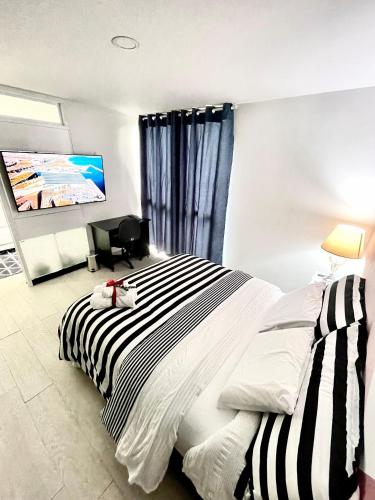 Llit o llits en una habitació de Confortable apartamento