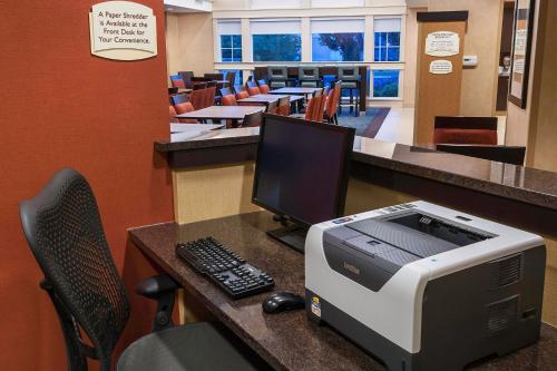 an office with a computer and a printer on a desk at Residence Inn by Marriott Madison West/Middleton in Middleton