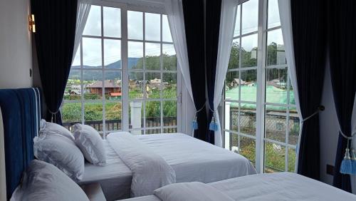En eller flere senge i et værelse på Golden Mist NuwaraEliya