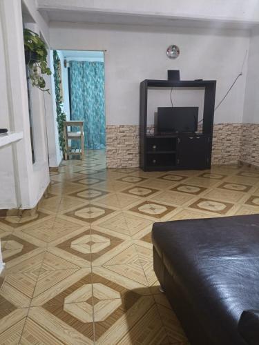 a living room with a television and a glass floor at Morada Quetzalcoatl in San Juan Teotihuacán