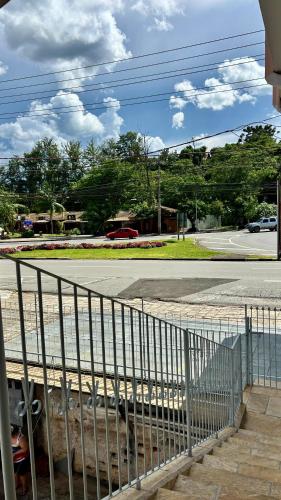 a fence on the side of a street with a road at Casa com excelente localização! in São Roque