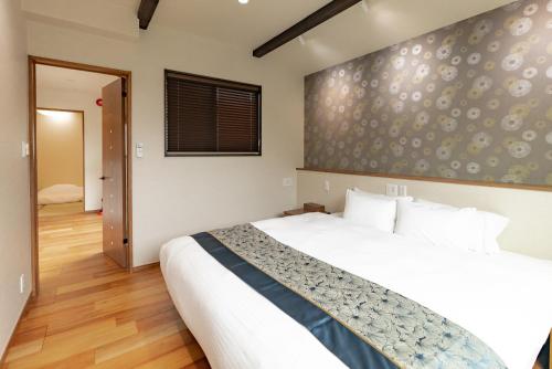 Cama o camas de una habitación en 谷町君 星屋 神泉ノ宿 二条城