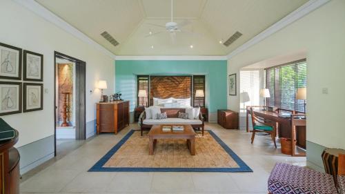a living room with a couch and a table at Cape Weligama - Relais and Chateaux in Weligama