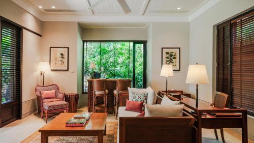 a living room with a couch and a table and chairs at Cape Weligama - Relais and Chateaux in Weligama
