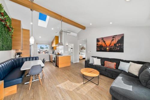 a living room with a couch and a table at Modern Luxury 2BR Apt in Heart of Ocean Beach in San Diego