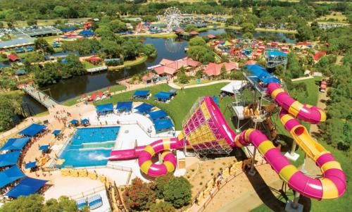 an aerial view of an amusement park with a roller coaster at Point Lonsdale Beach House - Relax Beach Surf Golf in Point Lonsdale