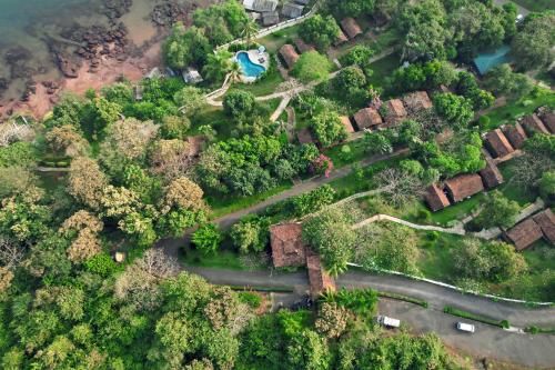 an overhead view of a village with trees and houses at Stone Water Eco Resort in Bogmolo