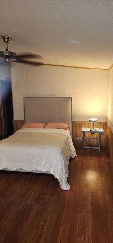 a bedroom with a large bed and a table at 1233 Apartment 3 Miami in Tamiami