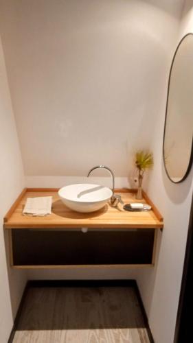 a bathroom with a sink and a mirror at Lapachos blco cabañas in Federación