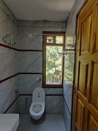 Ένα μπάνιο στο Hotel Greenland Inn Hampi