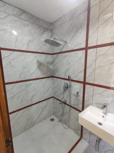 Ένα μπάνιο στο Hotel Greenland Inn Hampi
