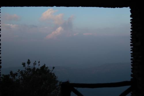 a view of the sky from a window at Simba Jungle Lodge, Binsar Wildlife Sanctuary in Binsar