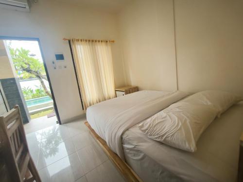 Ένα ή περισσότερα κρεβάτια σε δωμάτιο στο Ken Ken Guest House