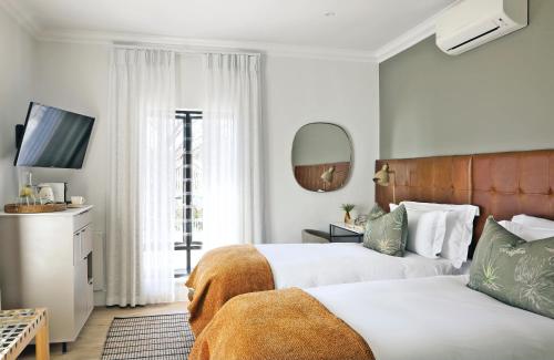 Кровать или кровати в номере Twice Central Guest House