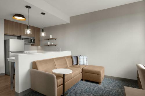 a living room with a couch and a table at Residence Inn by Marriott Eagle Boise in Eagle