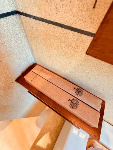 a wooden bench sitting on top of a ceiling at Madiha Venus in Matara