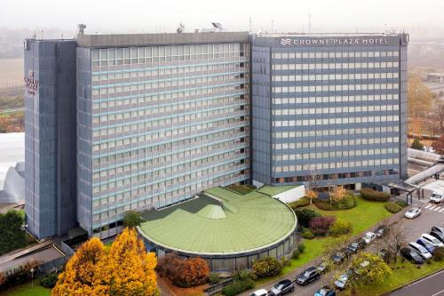 an overhead view of a large building with a green roof at Crowne Plaza Milan Linate by IHG in San Donato Milanese