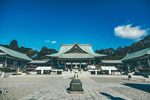 a pagoda building with a fountain in front of it at Kakegawa Grand Hotel in Kakegawa
