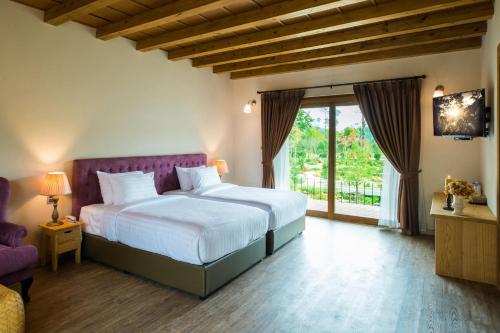 Ένα ή περισσότερα κρεβάτια σε δωμάτιο στο Mela Garden Retreat Cottage