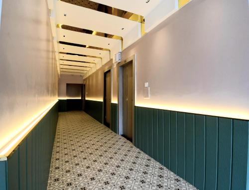 a hallway with a tile floor in a building at Hotel Sai Swastik in Puri