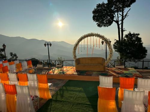 a set up for a wedding with a couch and chairs at Peaks And Pines Resort in Lansdowne