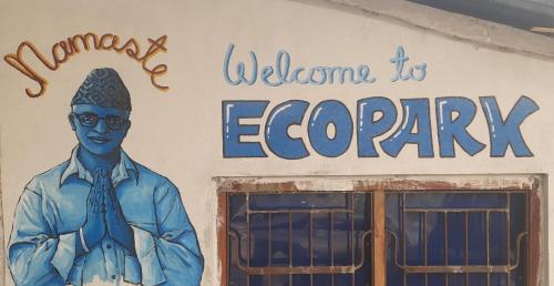 a building with a painting of a man in a tie at EcoPark in Meghauli
