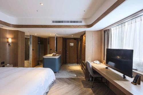 TV a/nebo společenská místnost v ubytování Hotel Royal Chihpin