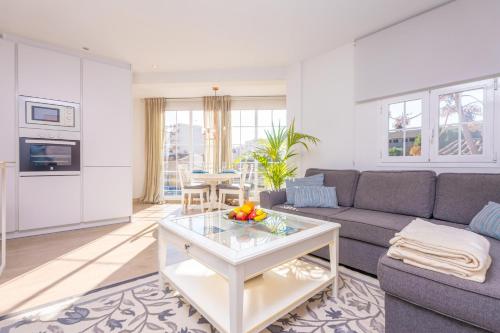 a living room with a couch and a table at Vacances Felanitx in Felanitx