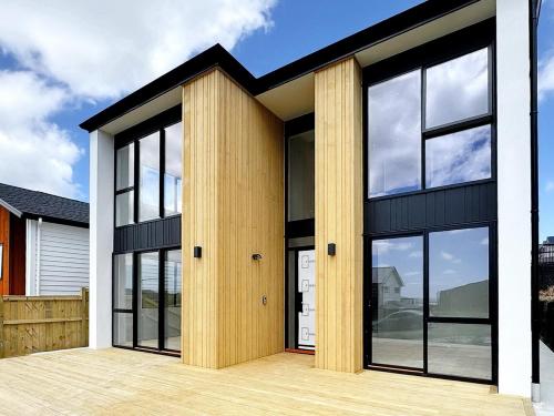 a modern house with black and white at Designer Brand New Large House Flat bush in Manukau City