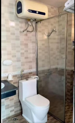 a bathroom with a toilet and a shower at Orient Tam Đảo Hotel in Tam Ðảo