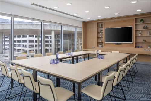 a large conference room with a large table and chairs at Hampton by Hilton London Gatwick Airport in Horley