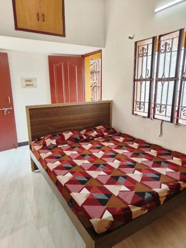 a bedroom with a bed in a room at ROYAL Homestay in Salem