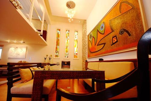 a living room with a table and a couch at Boracay Beach Houses in Boracay
