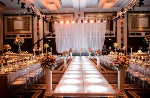 a banquet hall with a long table with chairs at Hilton Istanbul Bomonti in Istanbul