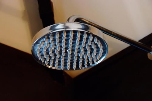 a close up of a shower head in a bathroom at Boracay Beach Houses in Boracay