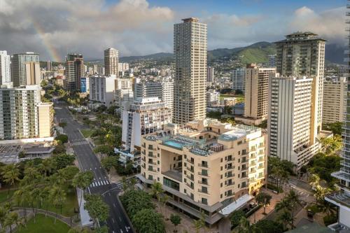 an aerial view of a city with a rainbow at Marriott Vacation Club, Waikiki in Honolulu