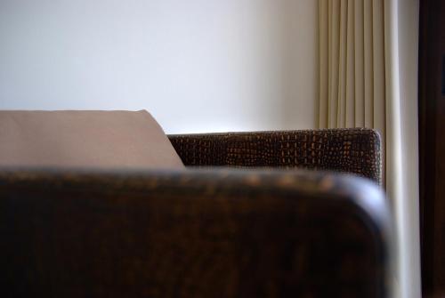 a close up of a chair in a room at Boracay Beach Houses in Boracay