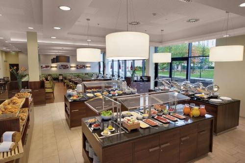a buffet in a hotel with food on display at Residence Inn by Marriott Munich City East in Munich