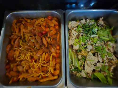 two plastic containers of food with beans and vegetables at Ramada by Wyndham Aonang Krabi in Ao Nang Beach