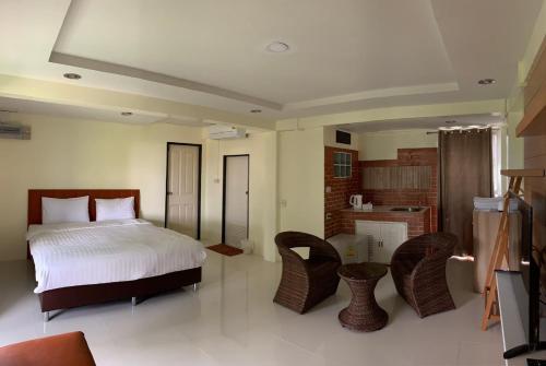 Ένα ή περισσότερα κρεβάτια σε δωμάτιο στο Petchsiri Boutique Hotel เพชรสิริ บูทิค