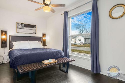 a bedroom with a bed and a window at NEW Urban Comfort On Grant St in Lake Geneva