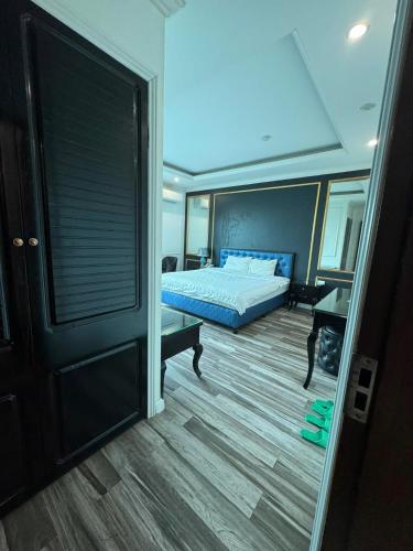a bedroom with a bed and a desk in a room at Venus Hotel Bắc Ninh in Bắc Ninh