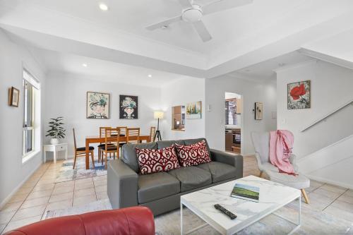 a living room with a couch and a table at The Villa on Shire - Comfort near Coorparoo Square in Brisbane