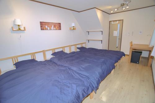 Postel nebo postele na pokoji v ubytování 横浜戸建て