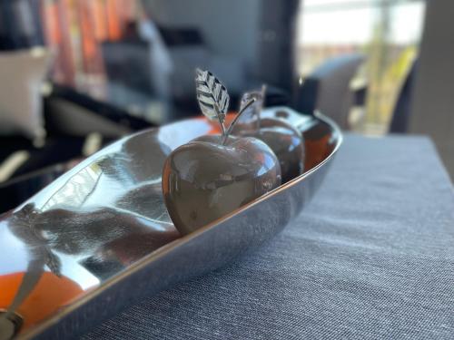 a plate of chocolate covered apples on a table at Apartment in der Nähe vom Lendplatz in Graz